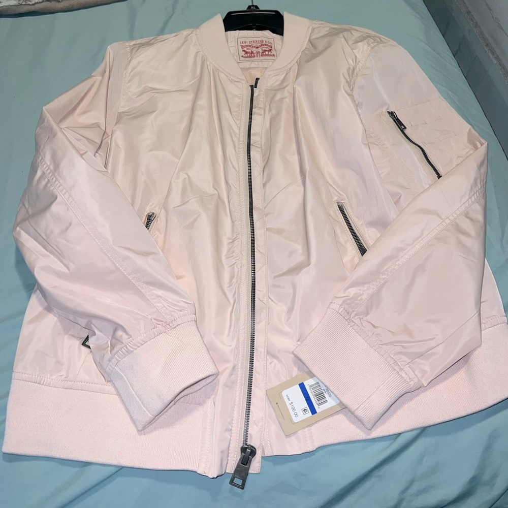 light pink levi bomber jacket.